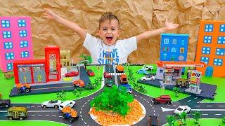 Влад и Ники играют с детскими машинками и строят Matchbox City